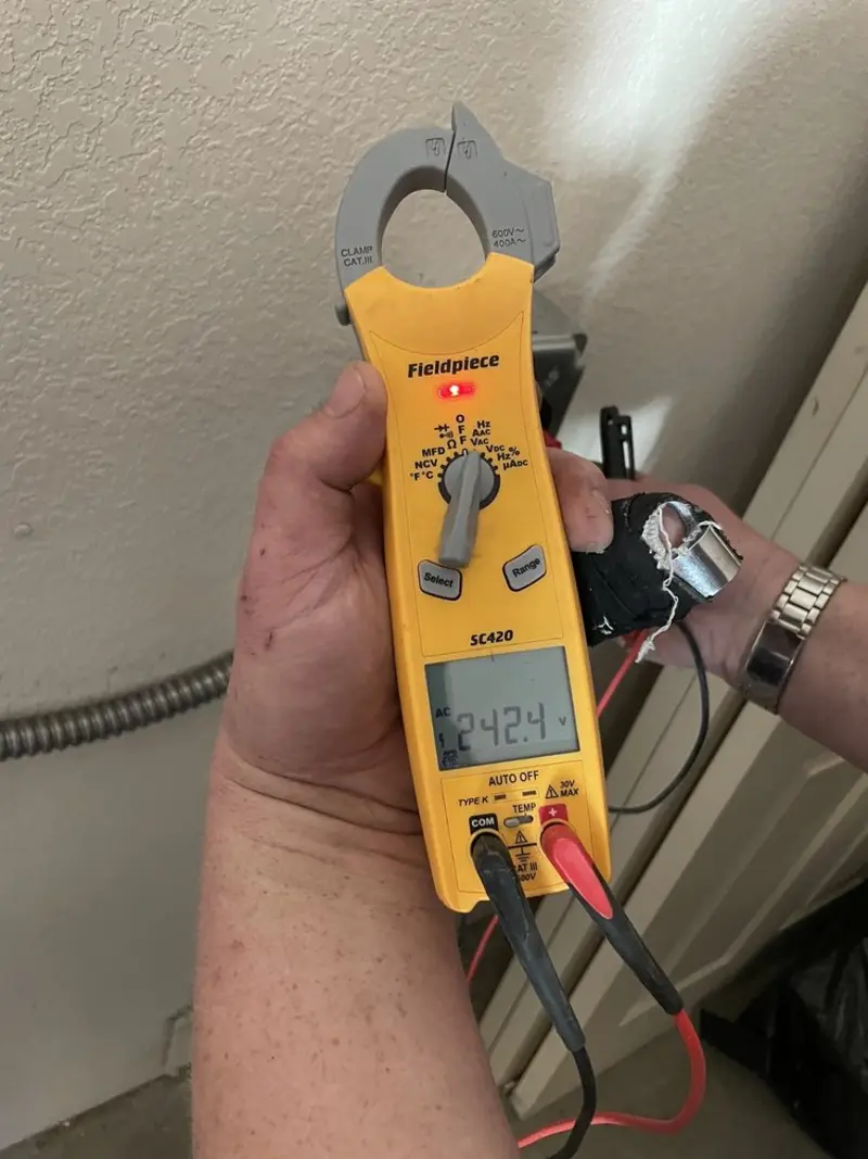 Voltage testing with clamp meter during Ceiling Fan Installation in Tuscumbia